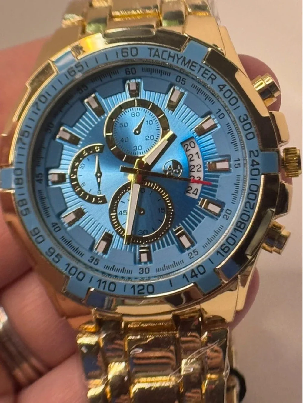 AJ heavy stainless steel, gold tone, blue face Sports Master